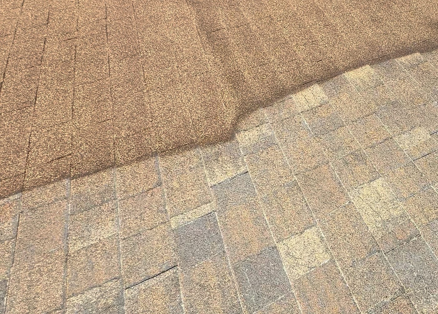 RainArmor elastomeric acrylic coating being applied over a prepared residential shingle roof