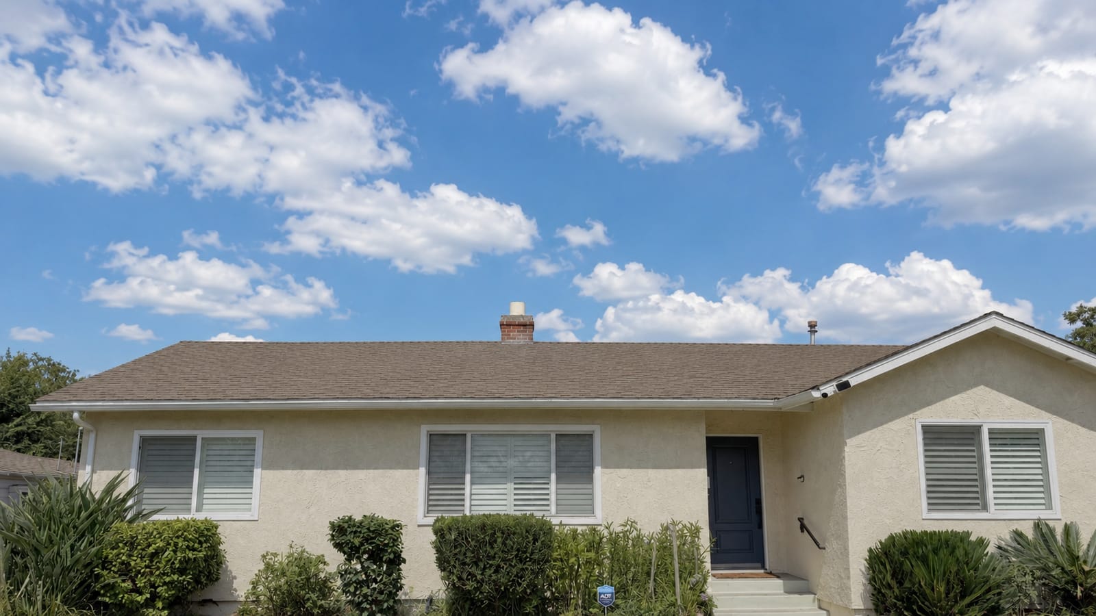 RainArmor reflective acrylic coating applied to a residential shingle roof in Southern California