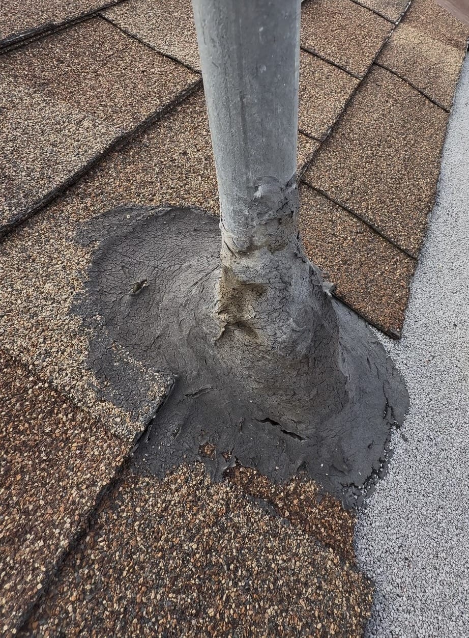Weathered shingle roof with backed-out nails and worn areas needing attention
